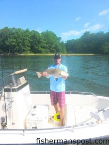 David Batson, of Burgaw, NC, with an over-slot red drum that bit a live finger mullet in Snows Cut while he was fishing on the "Seabacon."