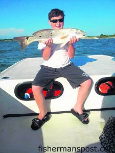 Storm Cline, of TN, with a 29" red drum he caught and released near Carolina Beach while fishing with Capt. Charlie Schoonmaker of Back Bay Fishing Charters.