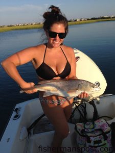 Tracy Saieed with a 26" red drum that attacked a Gulp shrimp near Richs Inlet while she was fishing on the "Wahoo."