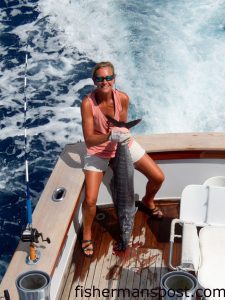 Maryann Redington with a wahoo that struck a purple/red sea witch near the Blackjack Hole while she was trolling on the "ANNALI."