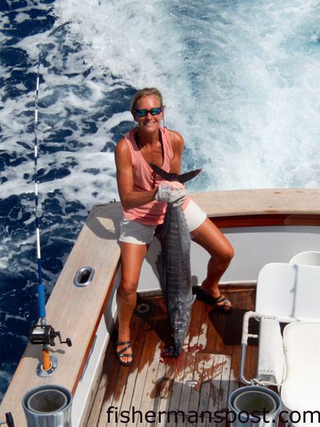 Maryann Redington with a wahoo that struck a purple/red sea witch near the Blackjack Hole while she was trolling on the “ANNALI.”