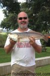 Tim Johnson, of Ocean, NC, with a 27" red drum that bit a Betts Halo Shrimp off his Bogue Sound dock.