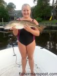 Makala Hall (age 12), of Archdale, NC, with her first red drum, a 25" fish that bit a live finger mullet while she was fishing Davis Creek on her borther's boat.