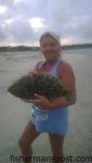 Renee Bennett, of Asheboro, NC, with a 20" flounder she hooked on a Gulp shrimp in Shallotte Inlet.