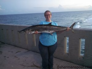 Annie Croom, of Wilmington, NC, with a 26.3 lb. king mackerel that bit a live bluefish off the end of Johnnie Mercers Pier.