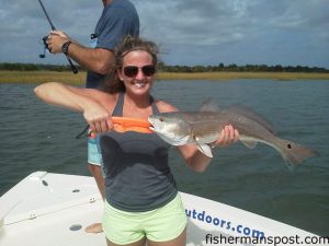 Brynn Shoffner, of Emerald Isle, with an upper-slot red drum that struck a live finger mullet in a Swansboro-area marsh while she was fishing with Capt. Robbie Hall of Hall'Em In Charters.