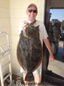 Robert Morgan, of Matthews, NC, with an 8.69 lb. flounder he hooked near Ocean Isle Beach. Weighed in at Sheffields.