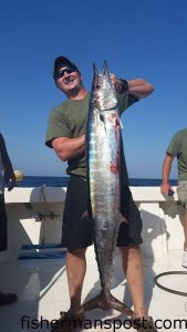 Jared Ziegler, a Marine from Wake Forest, NC, with a wahoo that struck a high-speed bait while he was fishing with Capt. Dave Gardner aboard the headboat "Vonda Kay" out of Wrightsville Beach.