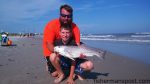 Justin and Aaron Holley with a 30" red drum Aaron caught and released in the surf near Topsail Inlet. The red fell for a live finger mullet.