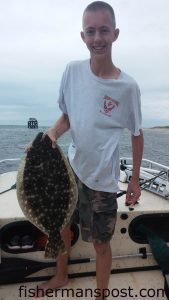 Noah Robinson (age 16), from Georgia, with a 24" flounder that struck a live menhaden near Bald Head Island.