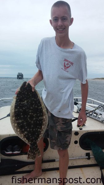 Noah Robinson (age 16), from Georgia, with a 24″ flounder that struck a live menhaden near Bald Head Island.