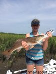 Molly Kelley, of New Jersey, with an upper-slot red drum that pounced on a live finger mullet while she and her father were fishing near Southport with Capt. Ryan Rayfield of Conjured Up Charters.