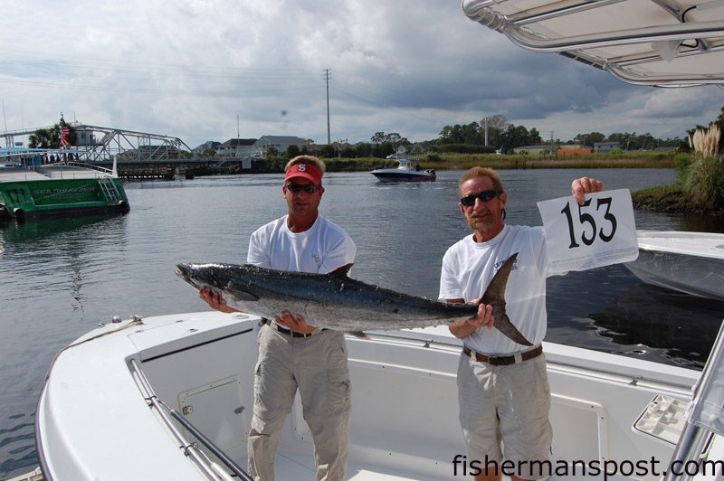 Chad Barnes and John Lewis–Morehead City’s “Second Chance” Fishing Team–with the 44.54 lb. king mackerel that earned them the tournament’s top prize. Their big fish struck a live bluefish a short distance off the beach at Oak Island.