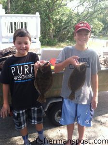 Nick and Chad McDonald, of Fayetteville, NC, with their first keeper flounder. Both bit live finger mullet in Lockwood Folly Inlet.