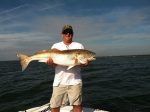 Benny Nye, of Lake Waccamaw, NC, with a 45" red drum that bit a live menhaden just off Ocean Isle Beach.