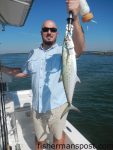 Travis Elliott, of Statesville, NC, with a 5 lb. spanish mackerel that struck a topwater plug in Little River Inlet while he was fishing with Capt. Patrick Kelly of Capt. Smiley's Fishing Charters.