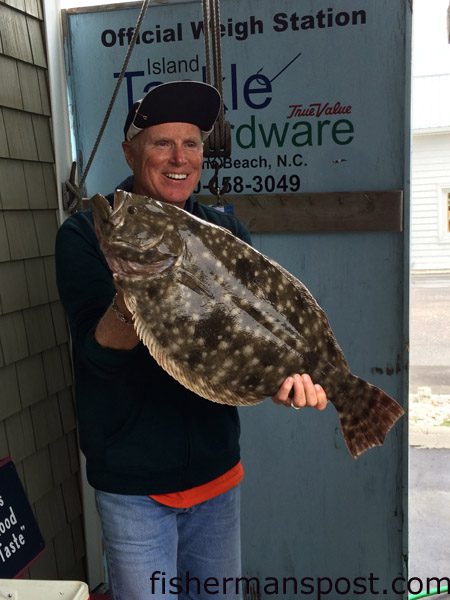 Vic Meredith, of Veradale, WA, with a 9 lb., 5 oz. flounder that attacked a live finger mullet while he was fishing near Carolina Beach with Capt. Dennis Barbour of Island Tackle Charters.