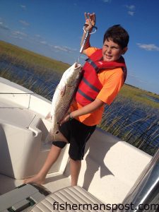 Dominic Jacaruso with 26.75" red drum that struck a soft plastic bait in the Cape Fear River while he was fishing with his father Jim on the "Phresh Phish."