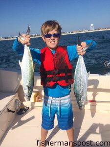 John David Allen (age 10), of Wilmington, with a pair of spanish mackerel he hooked on pink Clarkspoons just off Wrightsville Beach while fishing with his father and Mike Accattato on the "Dip-Sea-Dah."