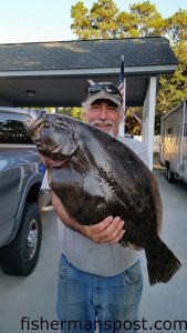 Tommy Craddock, of Oak Island, with a 12. lb., 14 oz. flounder that struck a Gulp shrimp in the ICW behind the island.