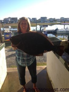 Kathy McLaurin, of Shallotte, NC, with a 12.83 lb. flounder that she hooked on a live finger mullet inshore of Ocean Isle Beach. Weighed in at Sheffields.