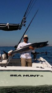 DeVan Barbour with an 83 lb. wahoo that struck a live menhaden while he was king mackerel fishing near the Northwest Places.