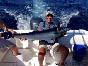 Nick Carnevale, of Wilmington, with a 50 lb. wahoo that struck a pink-skirted ballyhoo 68 miles off Masonboro Inlet.