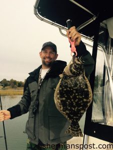 Brandon King, of Hampstead, with a 21" flounder that bit a Gulp-tipped bucktail jig in a local ICW creek.