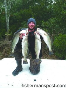 Capt. Rob Koraly, of Sandbar Safari Charters, with a brace of 4-6 lb. speckled trout that bit live mud minnows under popping corks in a mainland creek off Bogue Sound.