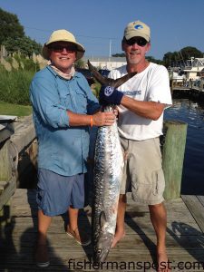 Thor Coole and Tony Hewett with a 42 lb. king mackerel that struck a cigar minnow on the downrigger near the 1700 Rock while they were fishing on the "Coole Cat." Weighed in at Chasin' Tails Outdoors.