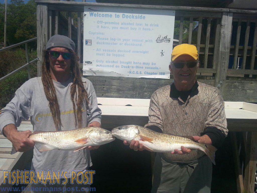 Mark and Steve Miner, from CO and OH, with a pair of red drum they hooked while fishing near Wrightsville Beach with Capt. Jamie Rushing of Seagate Charters.