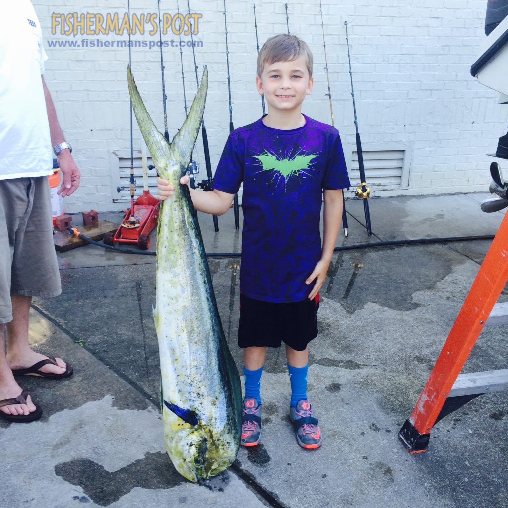 Preston Smith (age 8), from Wilmington, with a mahi caught 50 miles out of Masonboro Inlet. He was fishing on the "Leisure Time" with Greg Humphries, Shannon Welsh, and father Jason Smith.