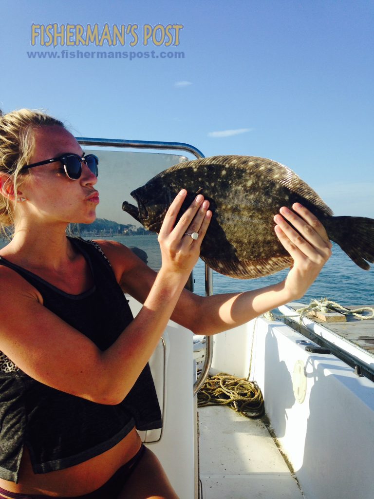 Meagan Spivey, of Wilmington, with her first flounder, a 19" fish that bit a live mud minnow in Carolina Beach Inlet.