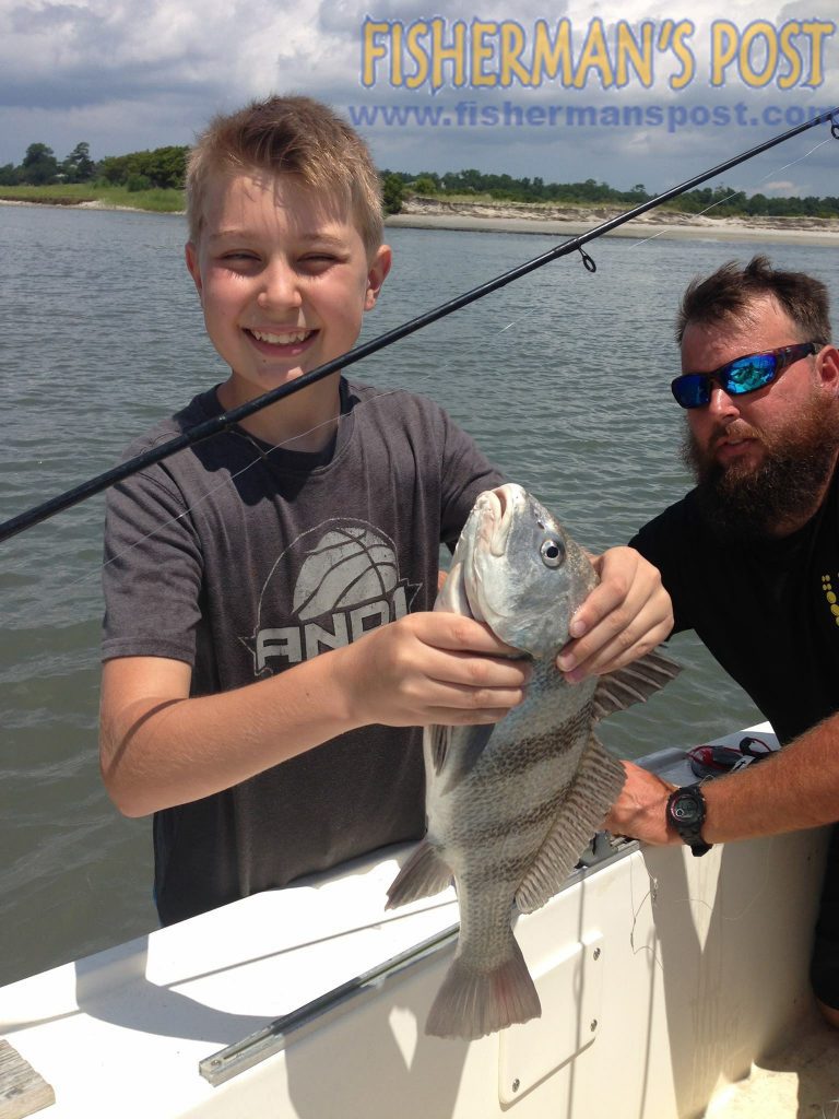 Hunter Holly with a black drum that bit a shrimp inshore at Topsail Beach while he was fishing with his dad.