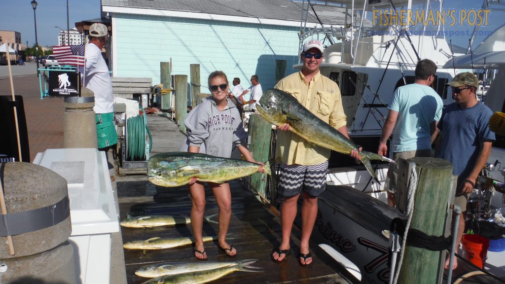 Rachel Anderson and Chris Hoenig, of Wrightsville Beach, with dolphin they caught along with a 600 lb. class blue marlin while trolling off Beaufort Inlet with owner Jake Ramsey and Capt. Gray Hall on the "Prime Time."