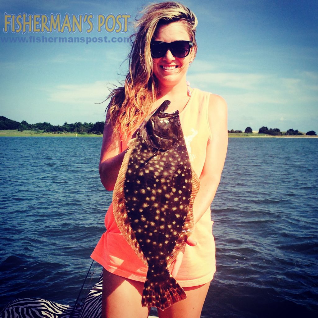 Jessica Dean with a 21" flounder that she landed after it attacked a live menhaden while she was fishing with her husband in the ICW near Carolina Beach.