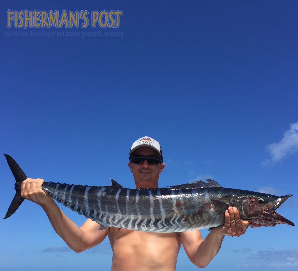 Drew Brown with a wahoo he hooked while trolling the Gulf Stream off Wrightsville Beach with Jonathan Blanchard.