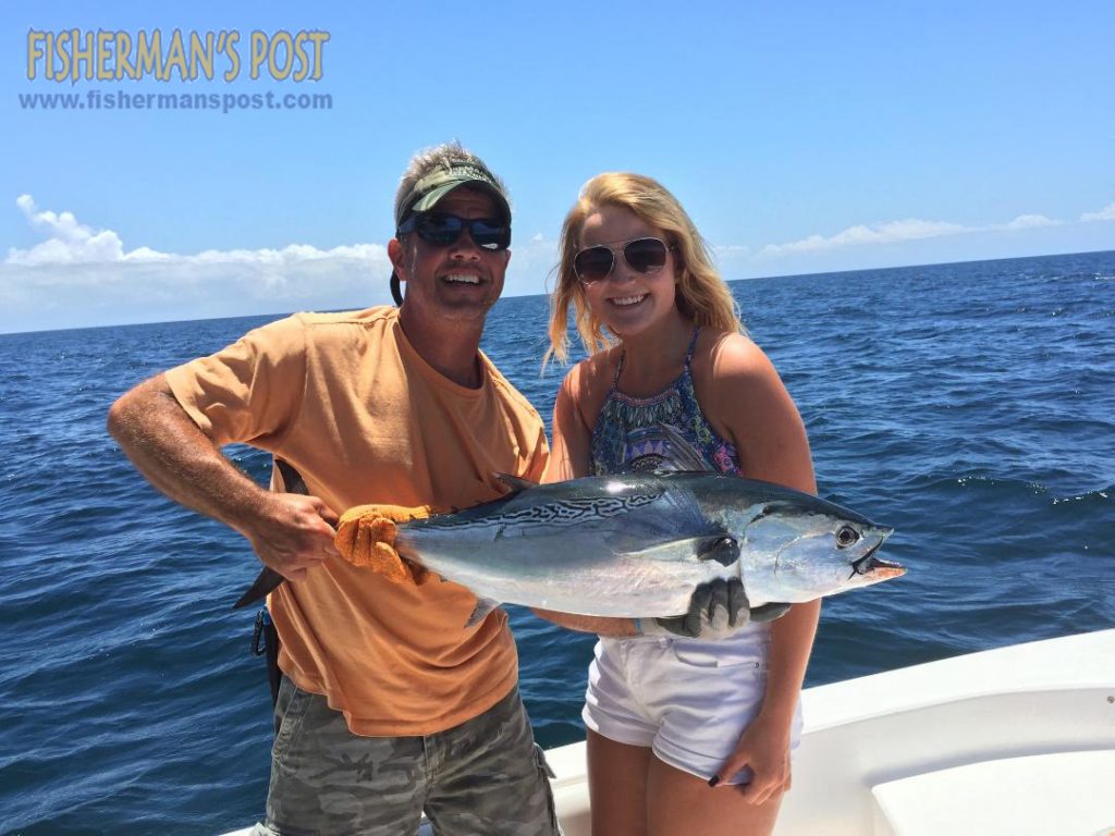 Haylee Dunn, of Burlington, NC, with a false albacore that she hooked while trolling a Clarkspoon off Cape Lookout with her father Harold.