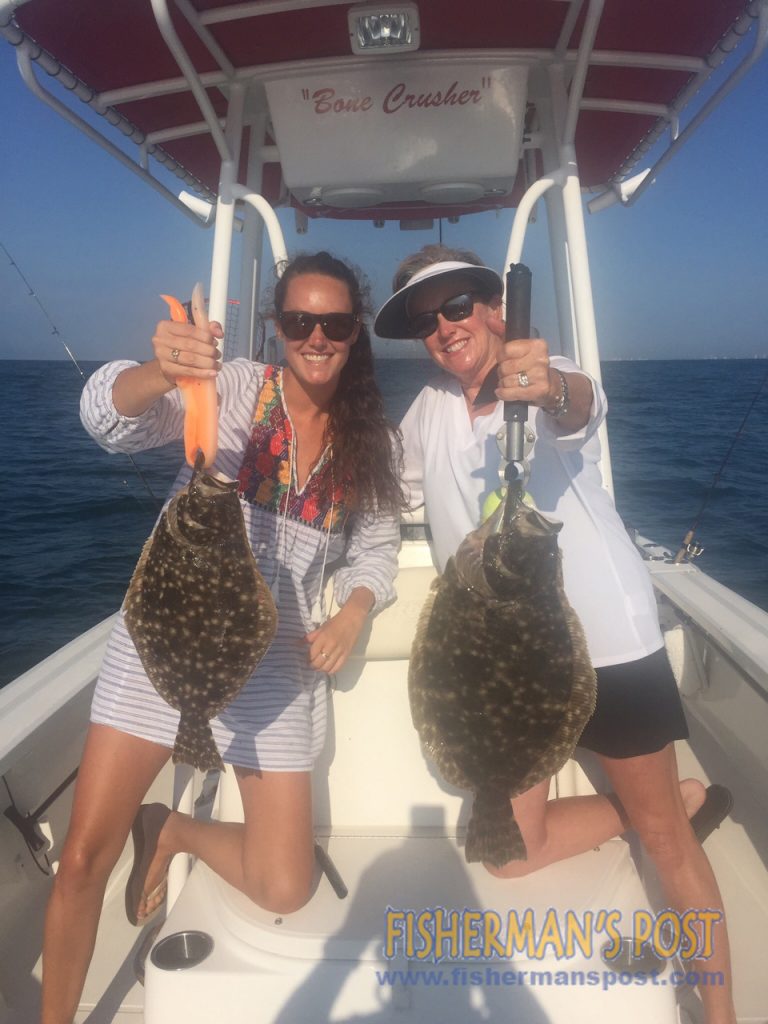 Lela and Liz Newell with a pair of flounder (the larger 4.8 lbs.) they hooked while fishing some nearshore structure off Ocean Isle with Brandon Sauls.