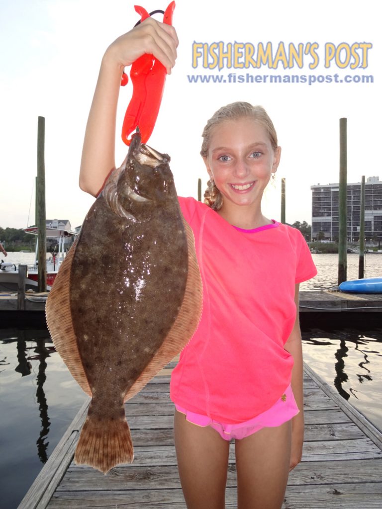 Macie Hall (age 10), of Carolina Beach, with a 20" flounder that bit a live minnow in the Cape Fear River.