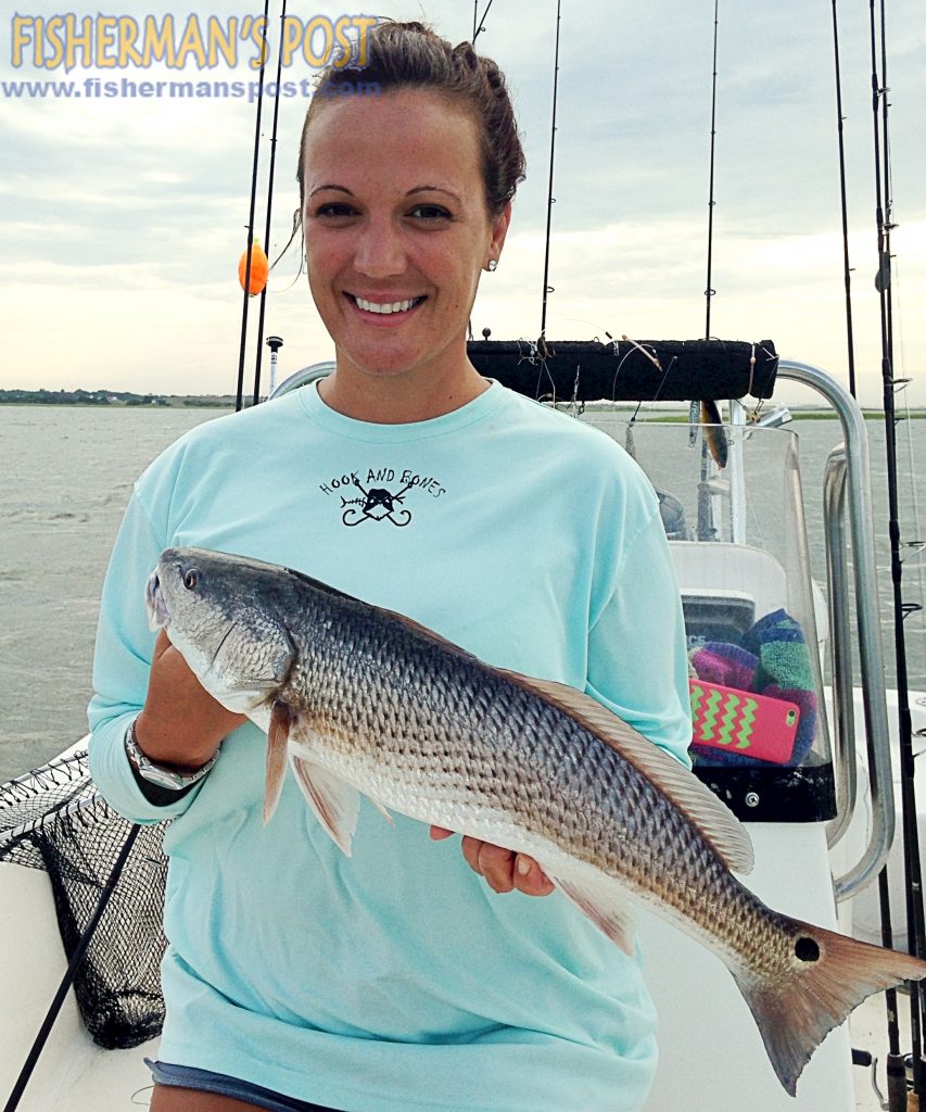 Shannon Hobbs, of Swansboro, with a red drum that bit a live finger mullet in Muddy Creek while she was fishing with Capt. Chris Sewell of Fishead Charter.