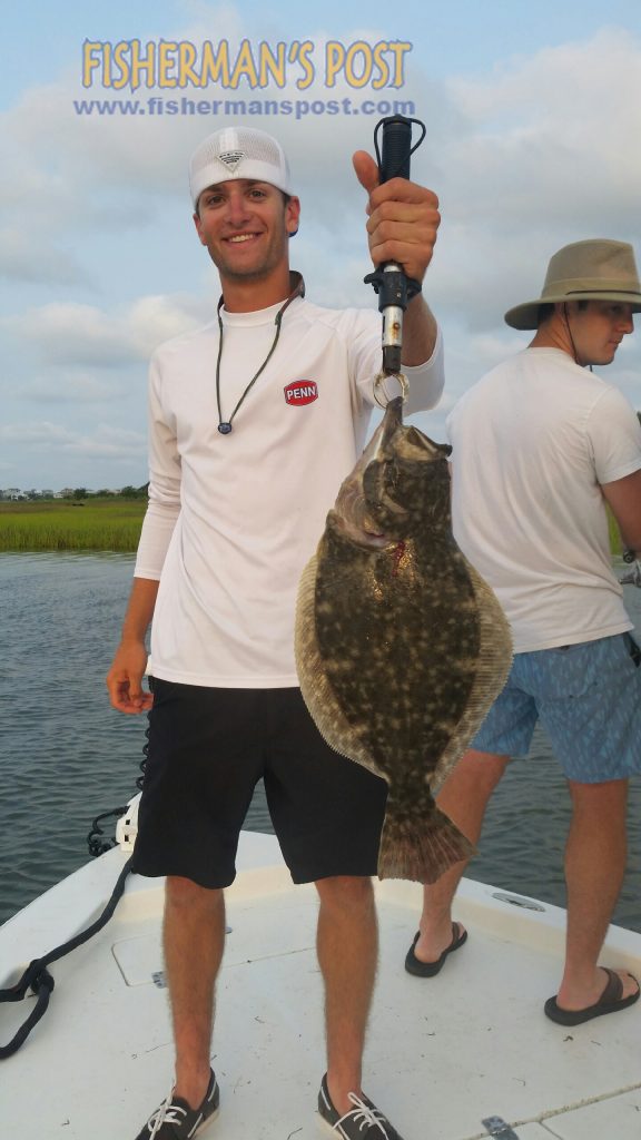 Josh Hollander, from Ohio, with a fat flounder that bit a 3" Gulp shrimp near Lockwood Folly Inlet while he was fishing with Capt. Kevin Sneed of Rigged and Ready Charters.