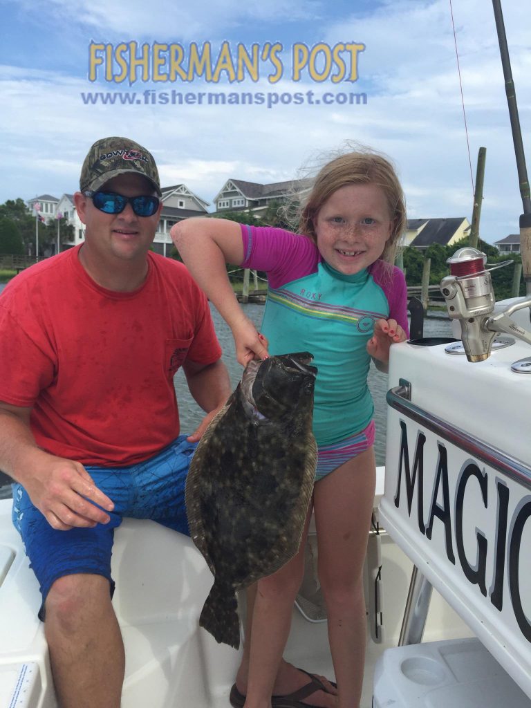 Kyle and Kaylee Sellers with Kaylee's largest flounder, a 4.5 lb. fish that bit a live menhaden in the ICW near Holden Beach.