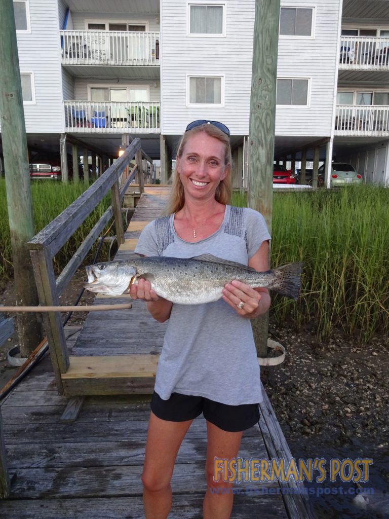 Jennifer Hall, of Carolina Beach, with a 4 lb., 2 oz. speckled trout that she hooked on a live mullet while fishing the Cape Fear River.