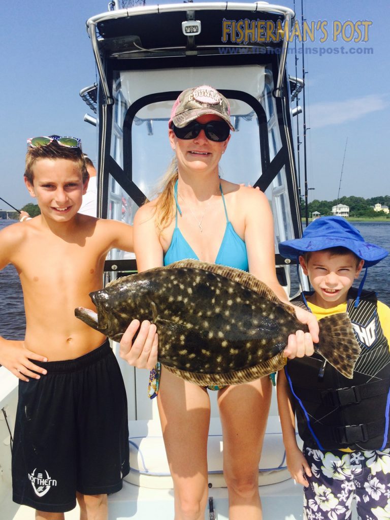 Preston Fisher (age 11) landed this 23" flounder near Carolina Beach Inlet after it struck a live mullet.