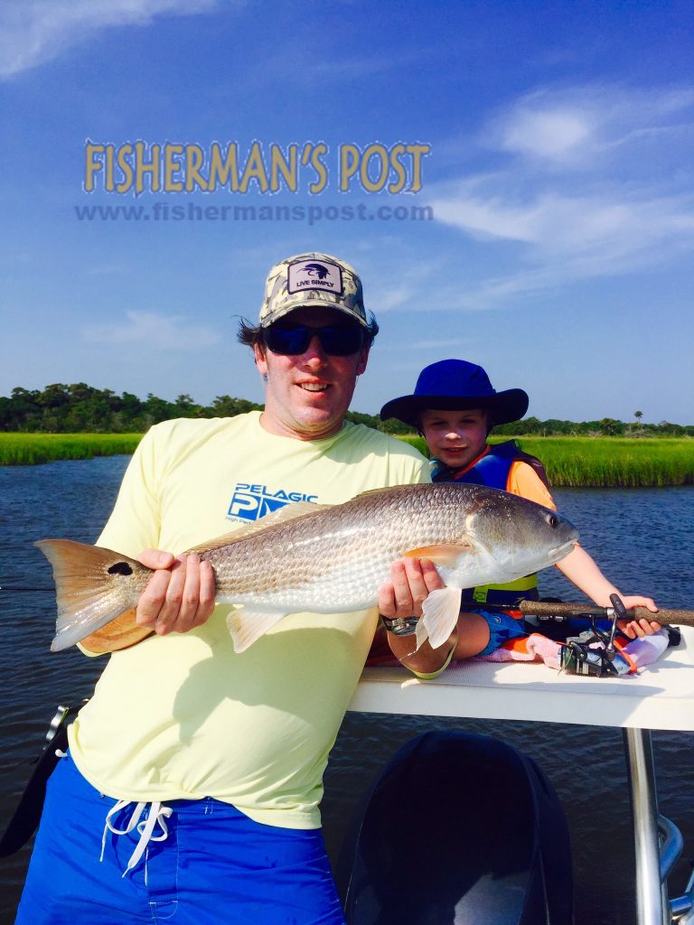 Tim and Thomas (age 6) Capps, of Raleigh, with an upper-slot red drum that bit a live bait near Bald Head Island while they were fishing with Capt. Mason Ward of Cape Fear Charter Company.