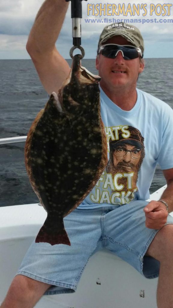 Lonnie Stewart, of Clover, SC, with a citation 24" flounder that bit a live menhaden near Oak Island while he was fishing with Capt. Wayne Freeman.