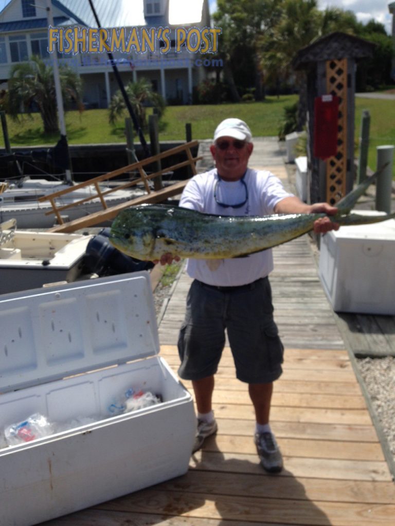 Harold Eichenholz, of Wilmington, with his first dolphin, hooked on a ballyhoo under a Blue Water Candy skirt while fishing 23 miles off Carolina Beach with Capt. Rod Bierstedt of OnMyWay Charters.