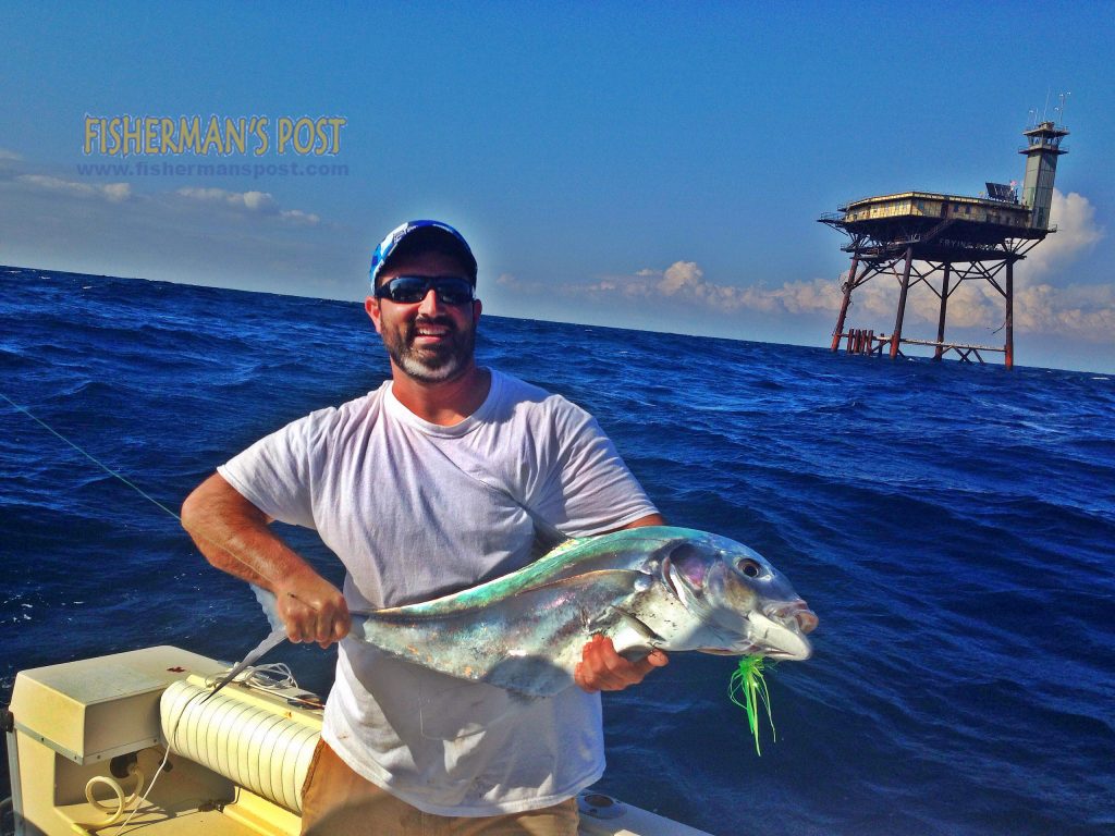 Dustin Hayes with an African pompano that bit a cigar minnow near Frying Pan Tower while he was trolling on the "Coffey Time."