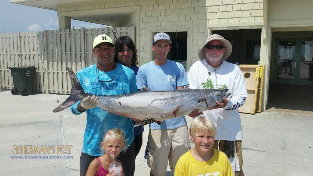 Derek Sawayer landed this pier record 50.3 lb. king mackerel after it struck a live bluefish off the end of Johnnie Mercers Pier. Also pictured are Caleb, Wes, and James Neil; Sydney Morgan Sawayer, and Brennan Leonard.